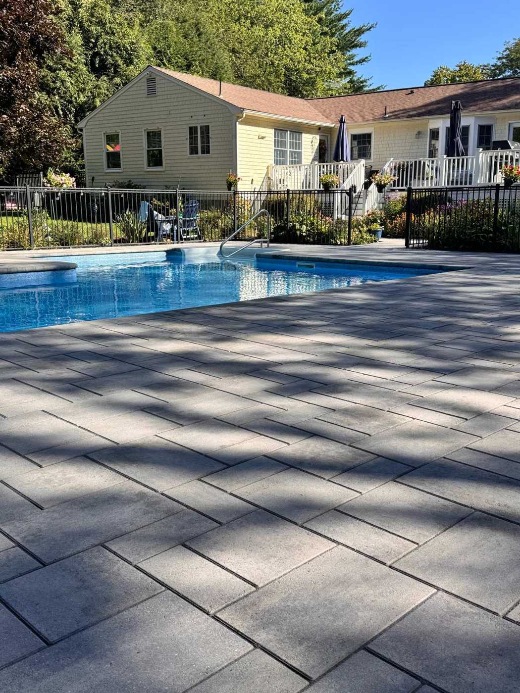 Gray paver pool deck washed, sanded and sealed by Paver Care RI